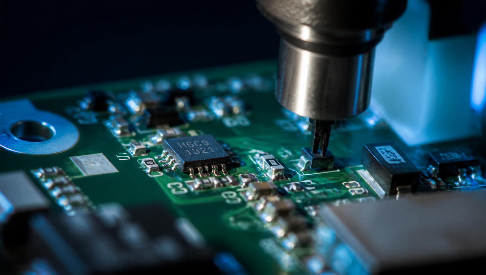 Macro view of a modern printed circuit board during surface-mount component placement